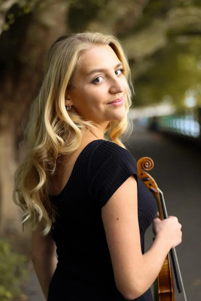 With her masterful skill and emotive playing, she brings classical music to life, creating enchanting musical moments that resonate with audiences. Image: "Athena Octavia Violinist London UK"