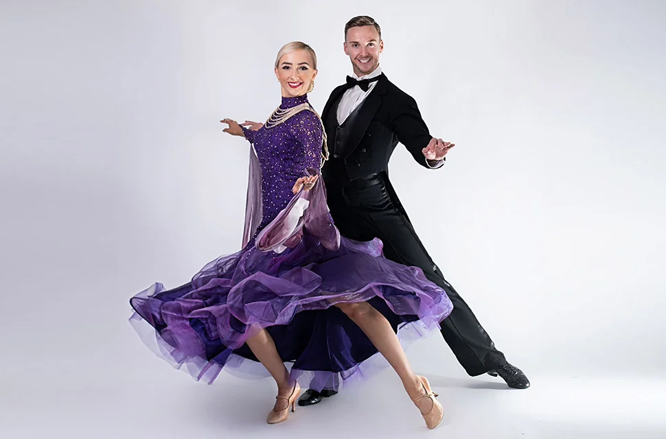 Joshua & Lowri: Ballroom Dance in London - Image showcasing Joshua & Lowri performing a graceful ballroom dance routine, their movements exuding sophistication and charm on the dance floor.