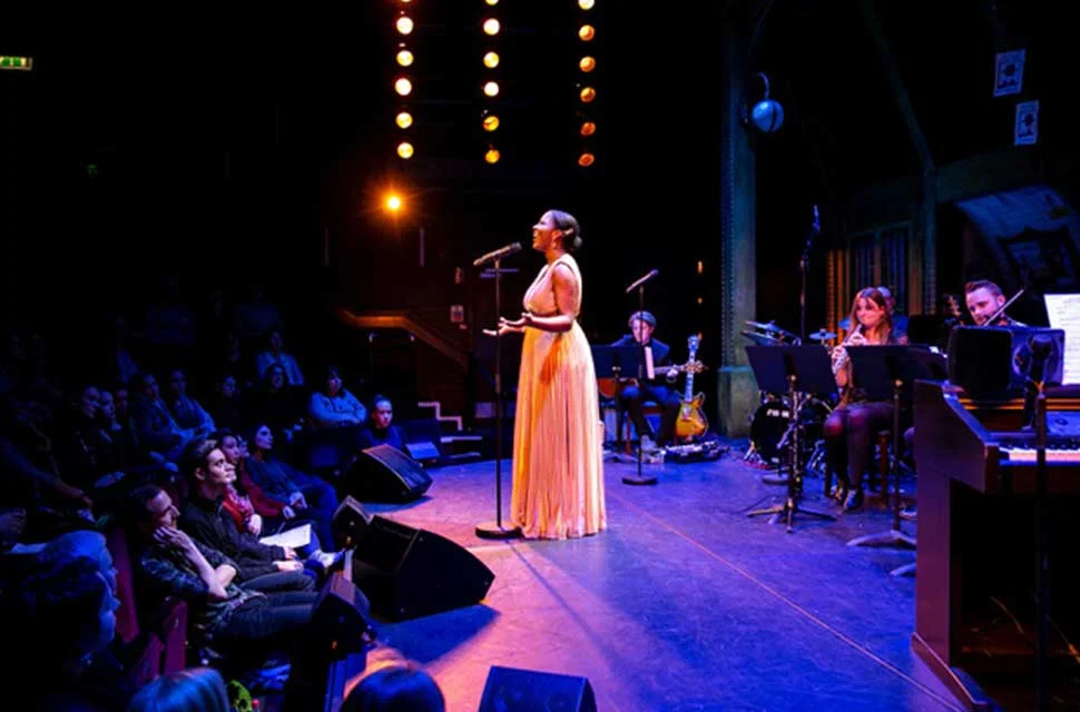 Image of Tshan Williams performing during the 'Love Me Tender' UK tour in London, captivating the audience with soulful melodies.